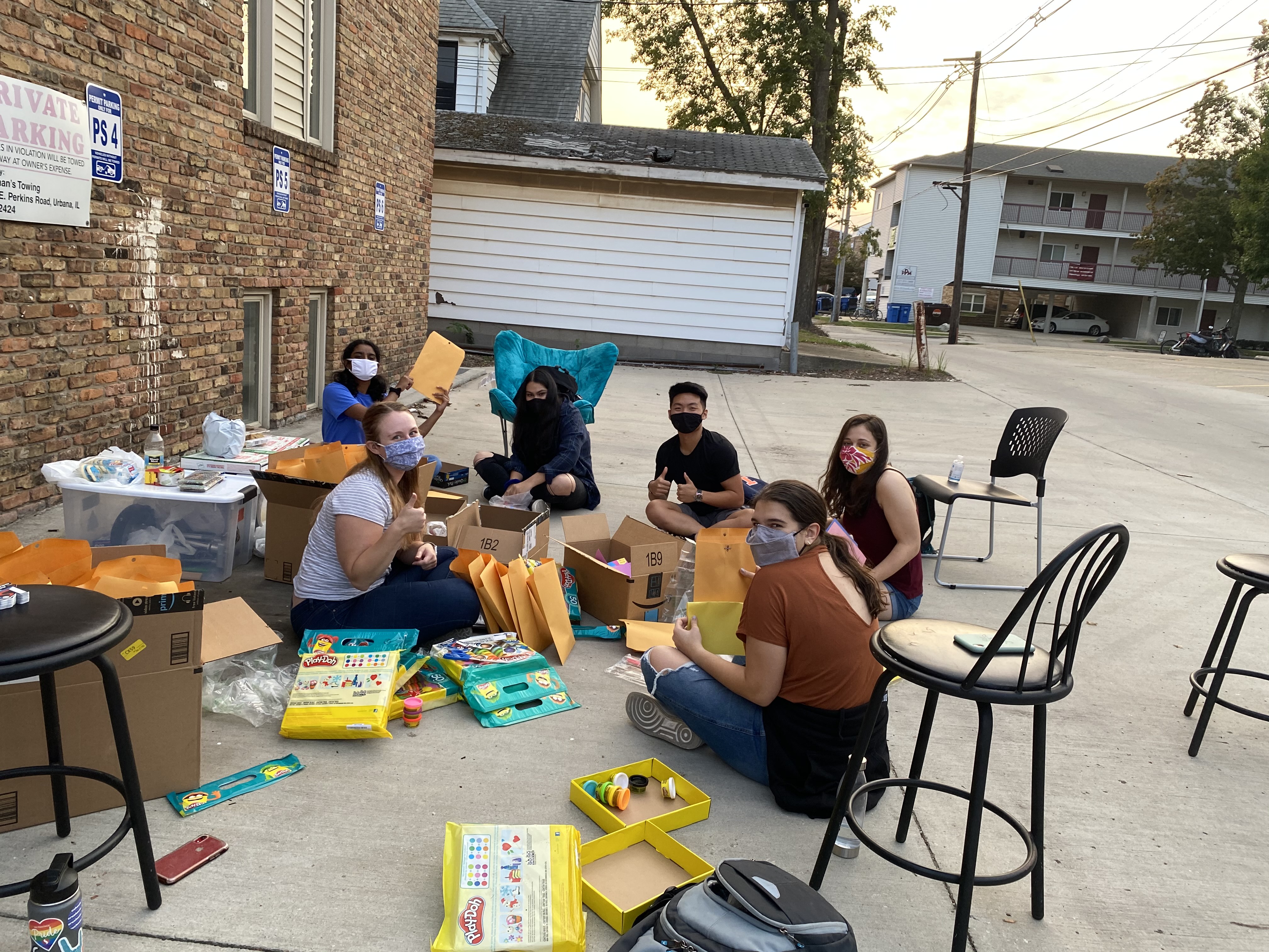 Stephanie Dutra with other Illinois Space Society members assembled Space Camp kits to be delivered to camper's homes during the pandemic year.