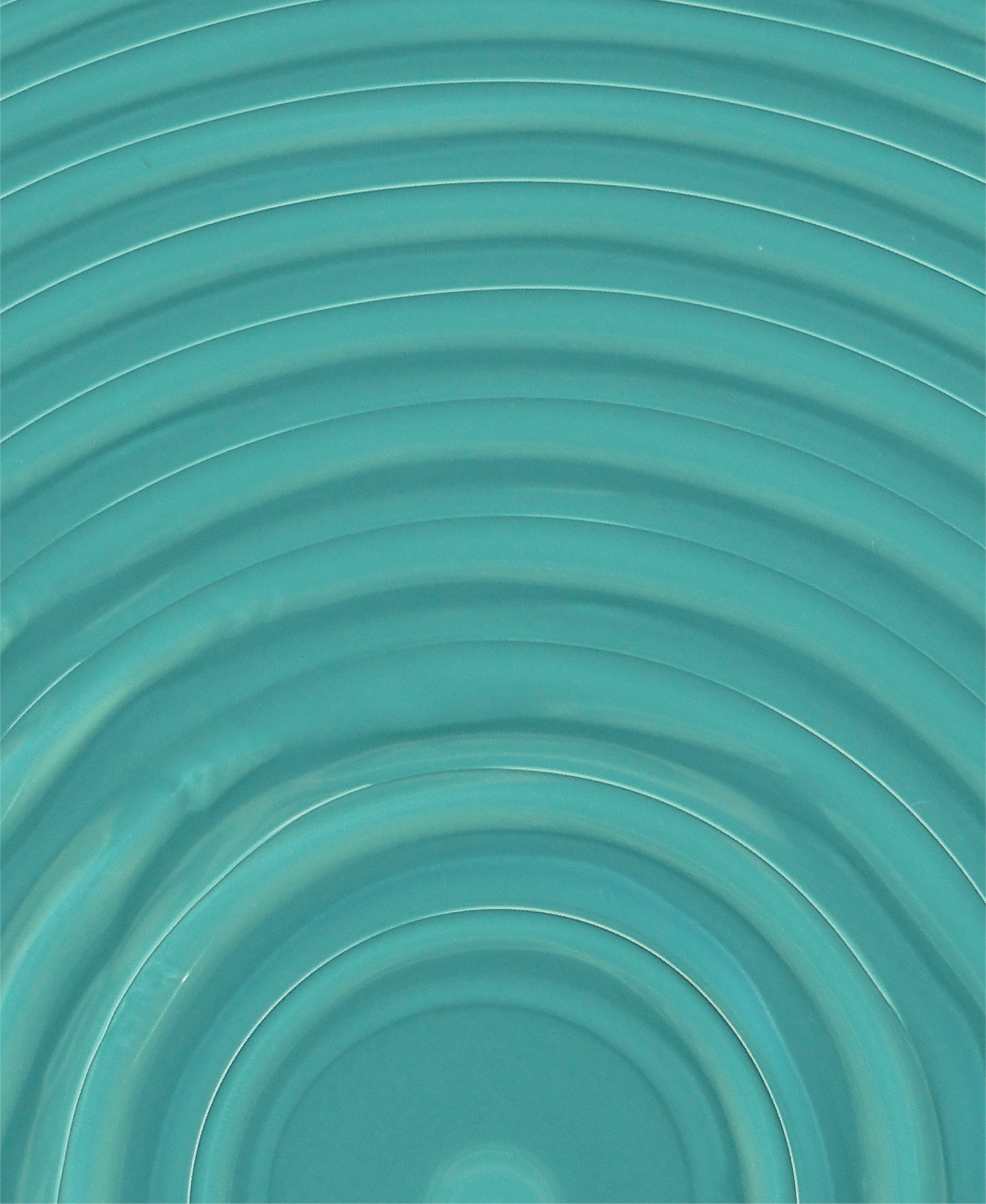 An optical image of the surface shows ridges generated spontaneously during free-surface frontal polymerization of dicyclopentadiene. The samples are imaged under UV light to enhance visualization.