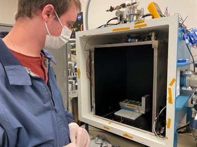 AE graduate student Eric Alpine takes inventory of samples being tested in the Laboratory For Advanced Space Systems at Illinois&rsquo; thermal vacuum chamber.