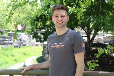 Michael Paradise on The Grainger College of Engineering quad during graduation week.versity of Illinois Urbana Champaign in 2020, and in 2021 he is the first graduate of the MEng program