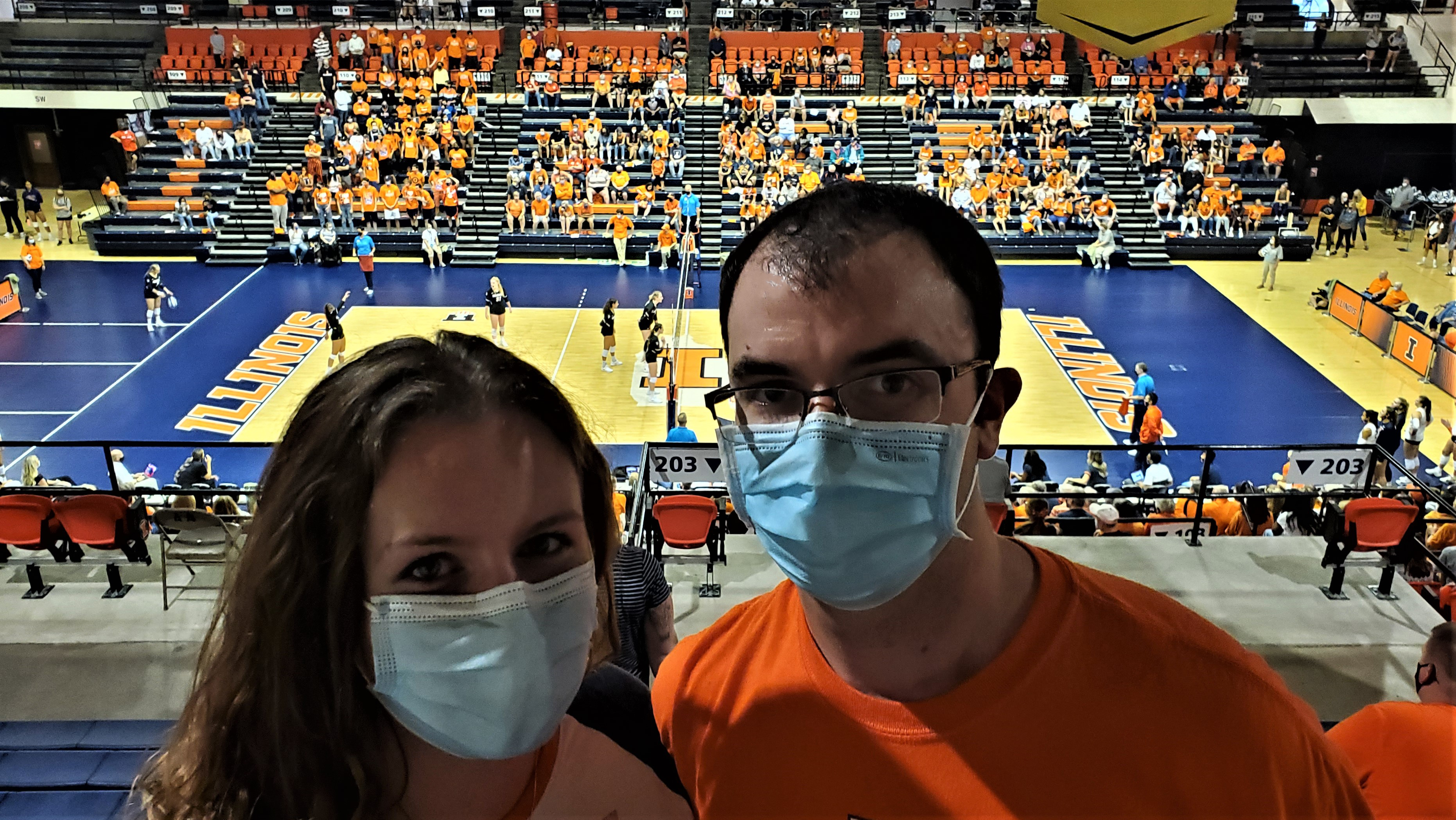 Matthew Kosky, BS '15 and his fianc&eacute;e Anna at a fall 2021 women's volleyball match 