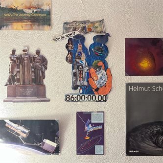 Some of the space-related items that decorate a wall in Sarangabany's room