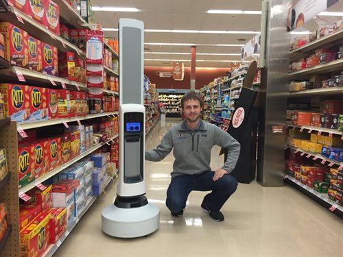 Macenski with Tally in a grocery store aisle in Cleveland, Ohio