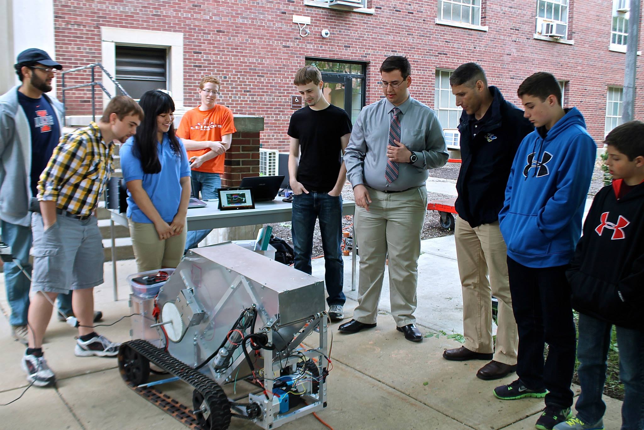 Macenski, center, as mechnical build chief for the Illinois Robotics in Space team during the 2014 visit with NASA astronaut Mike Hopkins