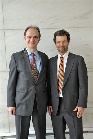 Ioannis Chasiotis, left, after his investiture as a Caterpillar Professor with Professor and Department Head Jonathan Freund.