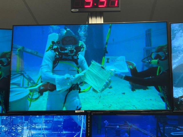 divers demonstrating UIUC team's tool