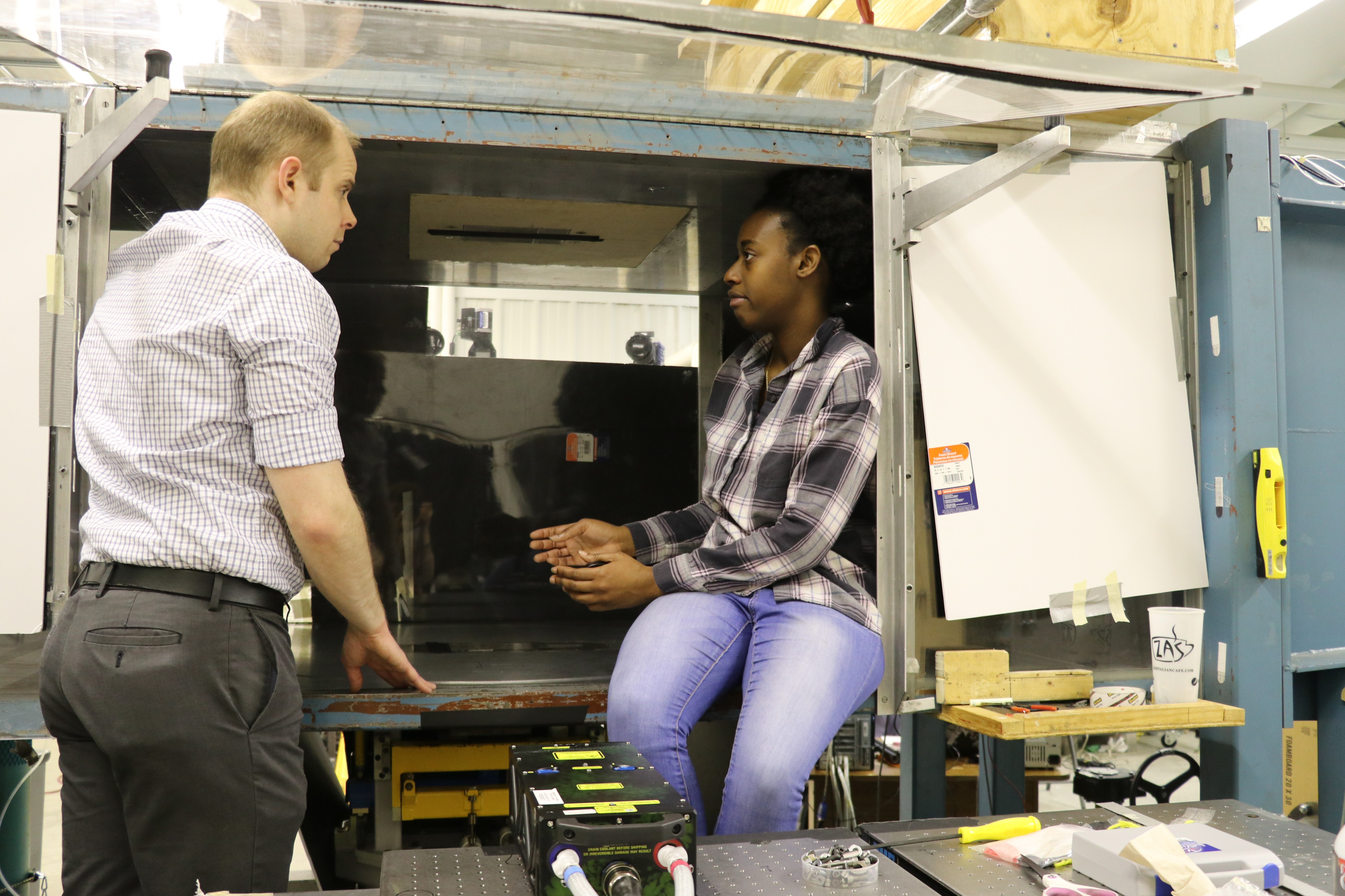 Awate consulting with Phillip Ansell in the lab.
