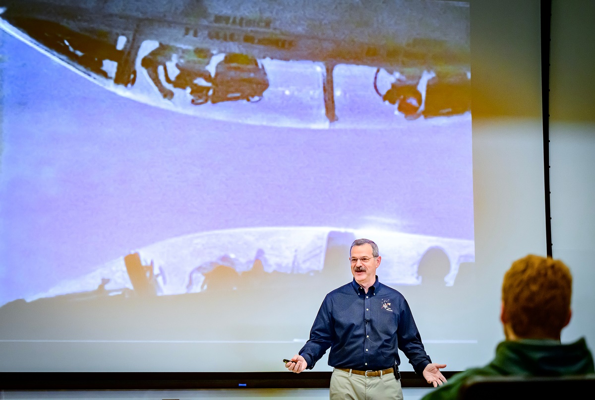 Scott Altman on Feb. 13, 2022, on the UIUC campus talks about his experience as a pilot in the 1986 film &amp;acirc;&amp;euro;&amp;oelig;Top Gun.&amp;acirc;&amp;euro;&Acirc;Â Altman is in the pilot in the plane at the top of the screen.