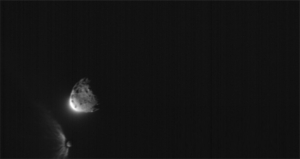 ASI&amp;acirc;&amp;euro;&amp;trade;s LICIACube satellite acquired this image just after its closest approach to the Dimorphos asteroid, after the Double Asteroid Redirect Test, or DART mission, made impact on Sep. 26, 2022. In this image, it is possible to observe the Didymos and Dimorphos from a different perspective, which can be useful to determine the shapes of the asteroids. Credit: ASI/NASA