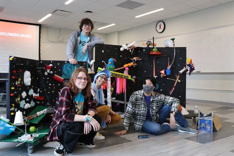 Front left to right: Sam Hulbert, Noor Ansari, and Cedric Sung. Standing: Cyrus LeMoine