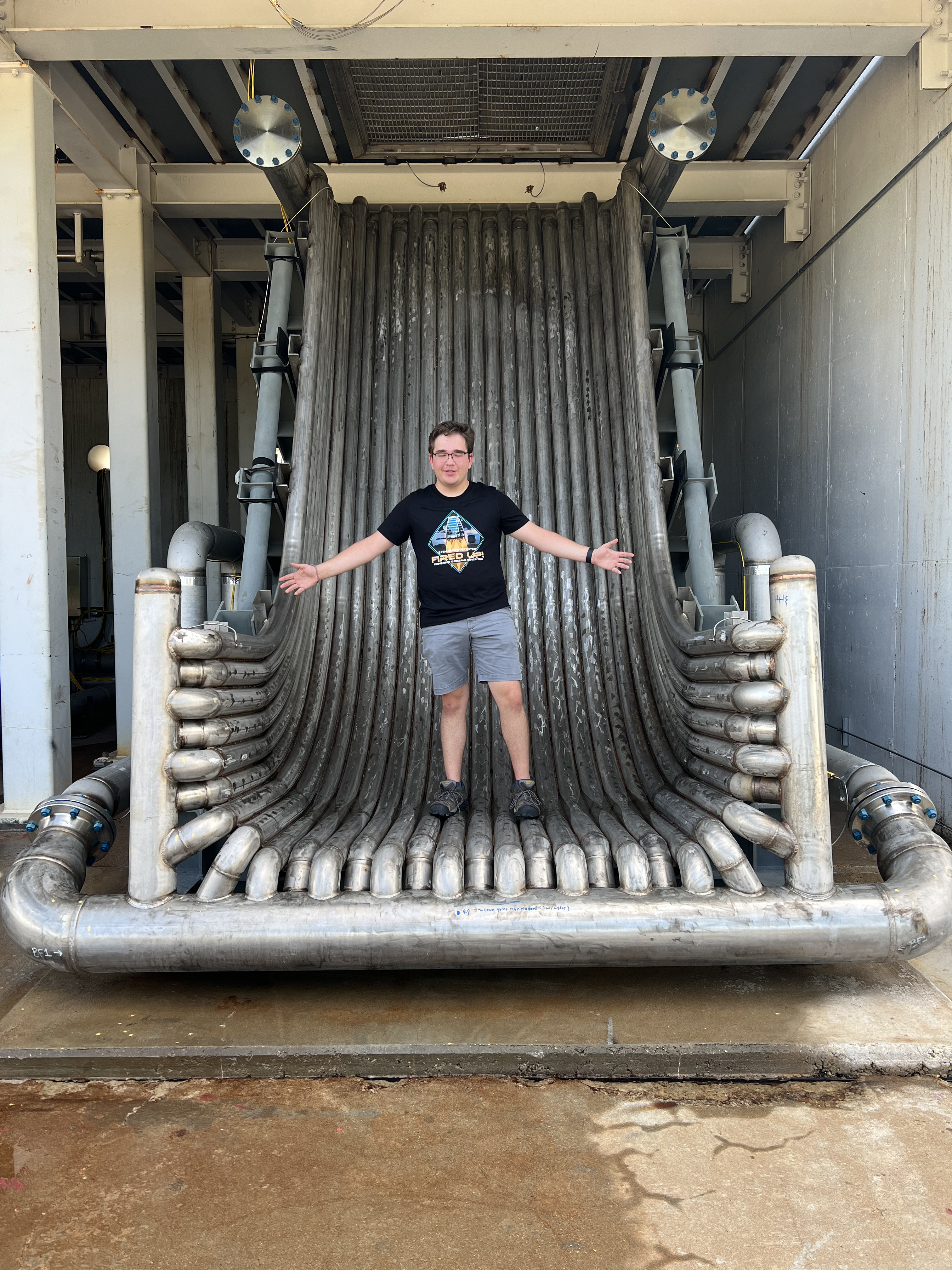 Monson standing on one of the flame diverters used by Relativity Space at their Stennis test site location. Whenever engines are tested at Stennis, the massive exhaust must be diverted sidewise, so the structure sprays out a ton of water to cool the steel and then physically diverts the flame sidewise.  Stennis employees referred to the diverter as the &amp;ldquo;Cheese Grater&amp;rdquo; as it was covered in many, small, sharp holes for the water to be sprayed out of.