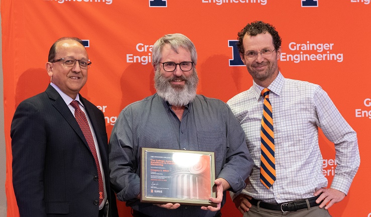 Grainger College of Engineering Dean Rashid Bashir, Greg Elliott, and AE Dept. Head Jonathan Freund at college awards celebration