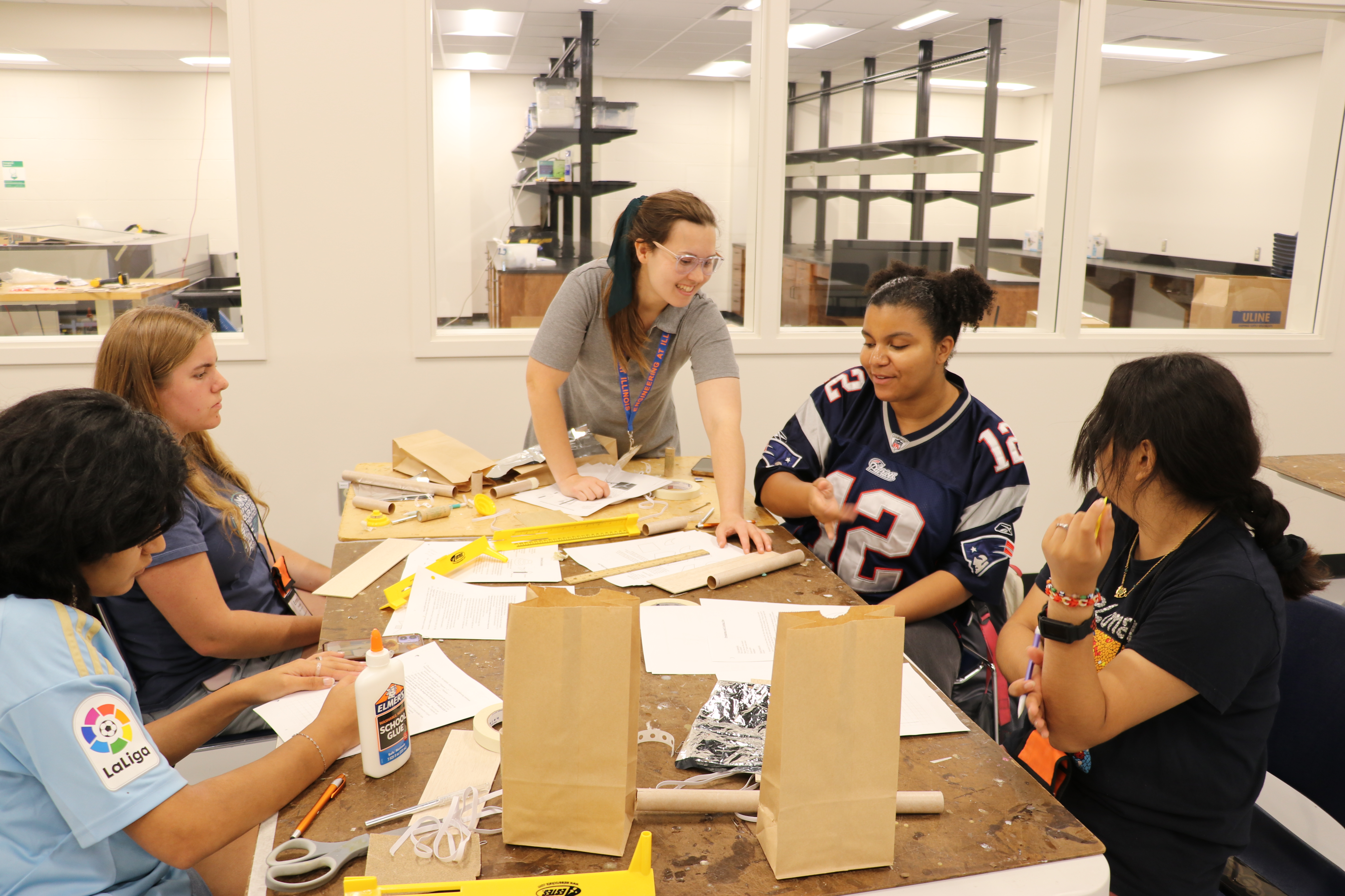 Students at a summer camp building model rockets and gliders