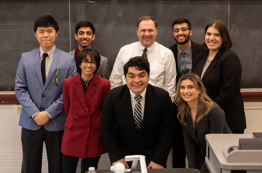 Team Jackalope, front row left to right: Noor Ansari, Evher Benjamin Aponte, and  Sarah Erne. Back row left to right: Hsien-Kuei Chang, Anish Joshi, Professor Jason Merret, Krishna Modi, and Stephanie Dutra.