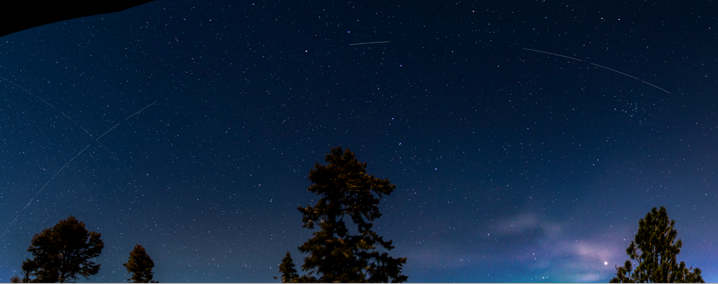 The bright streaks drawing an arc across the night sky are caused by the satellite BlueWalker 3. Credit: Ilse Plauchu-Frayn