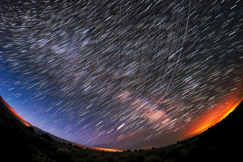 Starlink satellites pass overhead near Carson National Forest, New Mexico, photographed soon after launch. Credit: M. Lewinsky