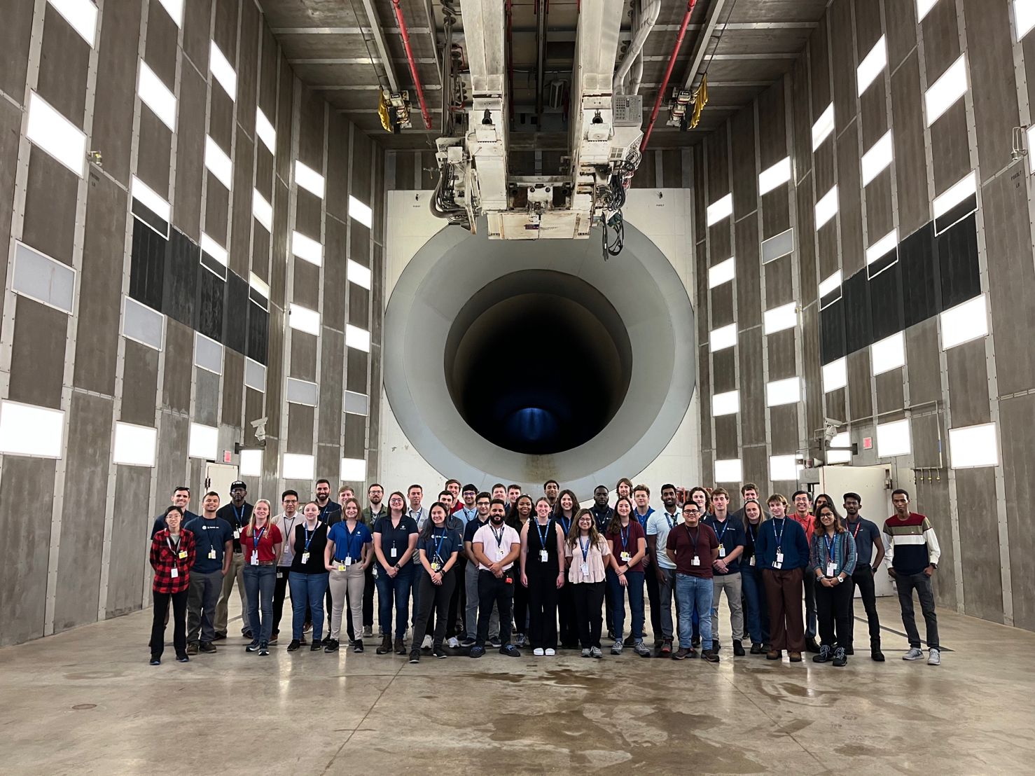 Lau, far right in red shirt, at Peebles, Ohio, where GE conducts the full engine tests