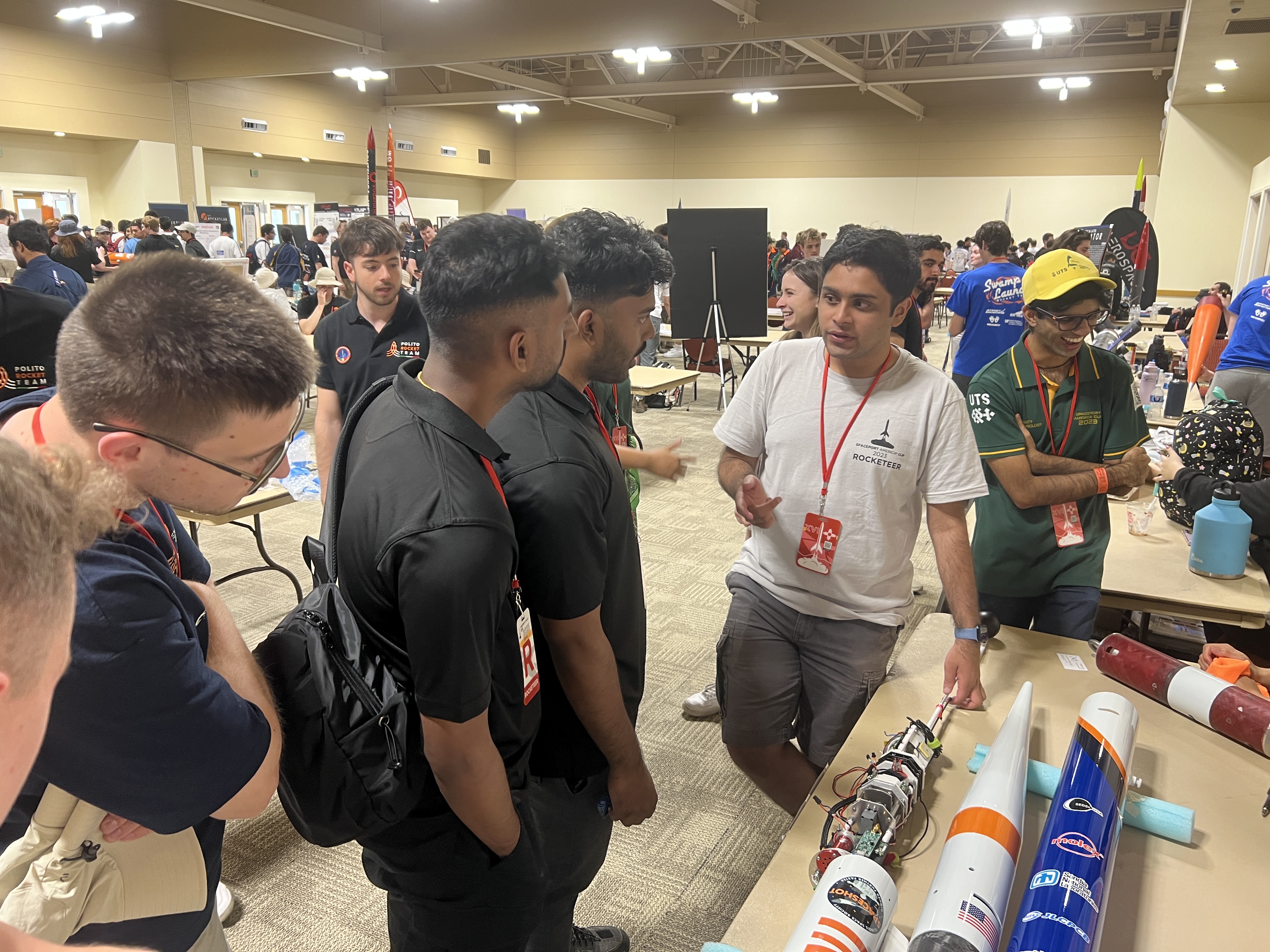 Shrotri explaining the control system architecture to other collegiate teams at Spaceport America Cup 2023.