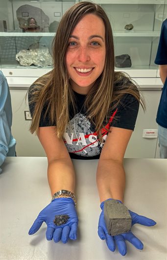 Adam holding lunar and martian meteorites at the Smithsonian National Museum of Natural Histor