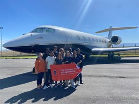 Posing with a Gulfstream 650 during a tour of ExecuJet at Cape Town International Airport.