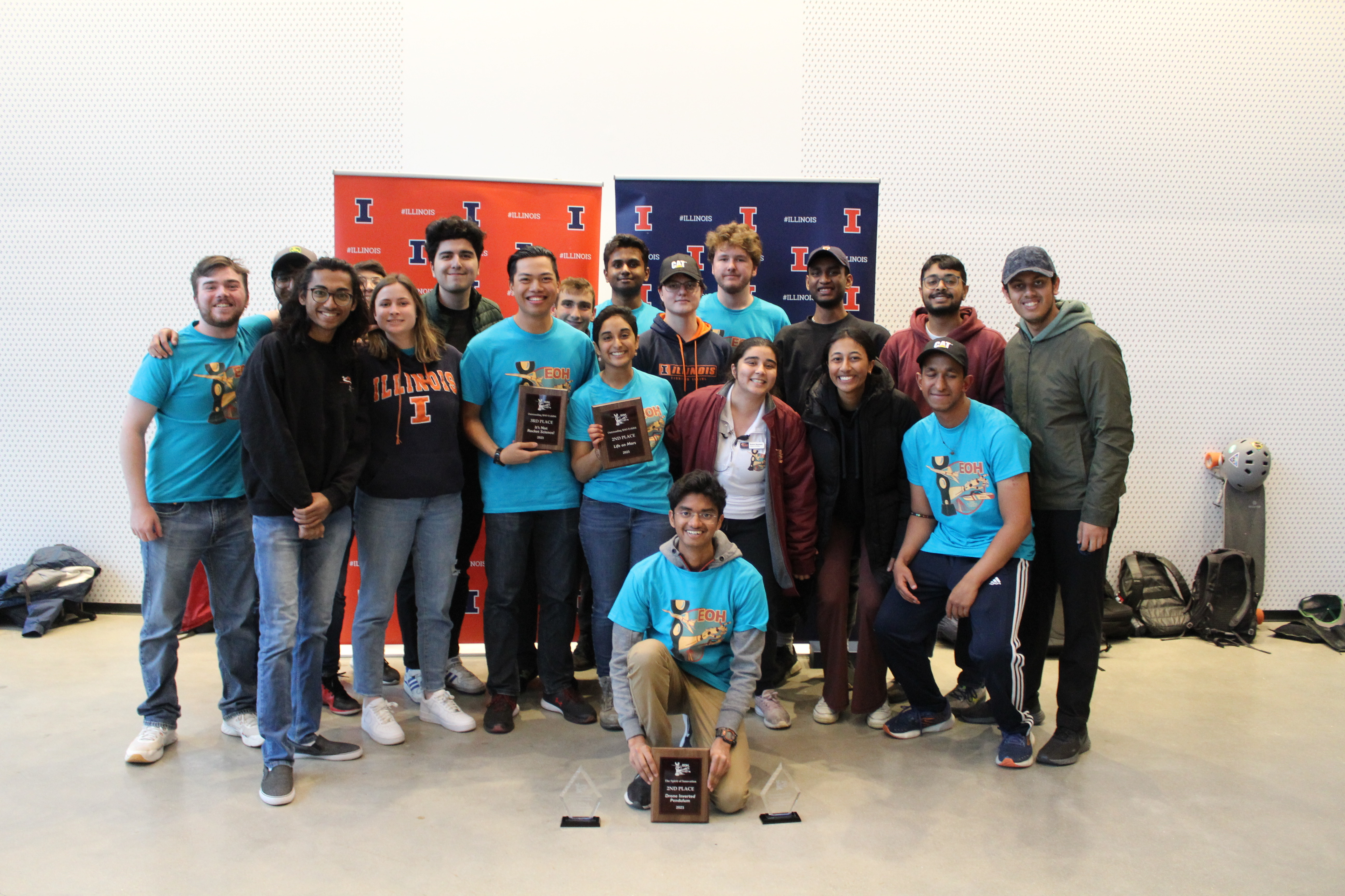 Ramesh front row white top, with members of the Illinois Space Society after winning 2nd place for their exhibit at the 2023 Engineering Open House
