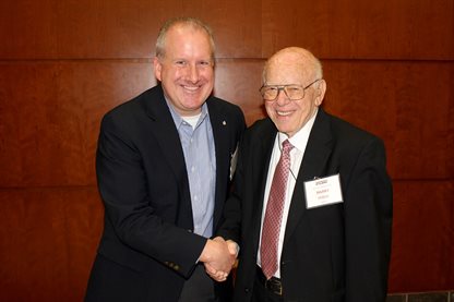 Dan Jensen and Harry Hilton at a dinner honoring Hilton in February 2015.