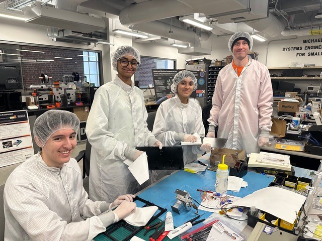 Left to right: AE undergraduate students Hector Ibarra, Niharika Navin, and Aalia Angirish and team lead PhD student Phoenix Merrick Alpine.