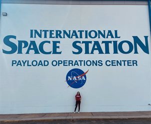 McBride on a Pathways intern tour outside the ISS Payload Operations and Integration Center at the Marshall Space Flight Center.