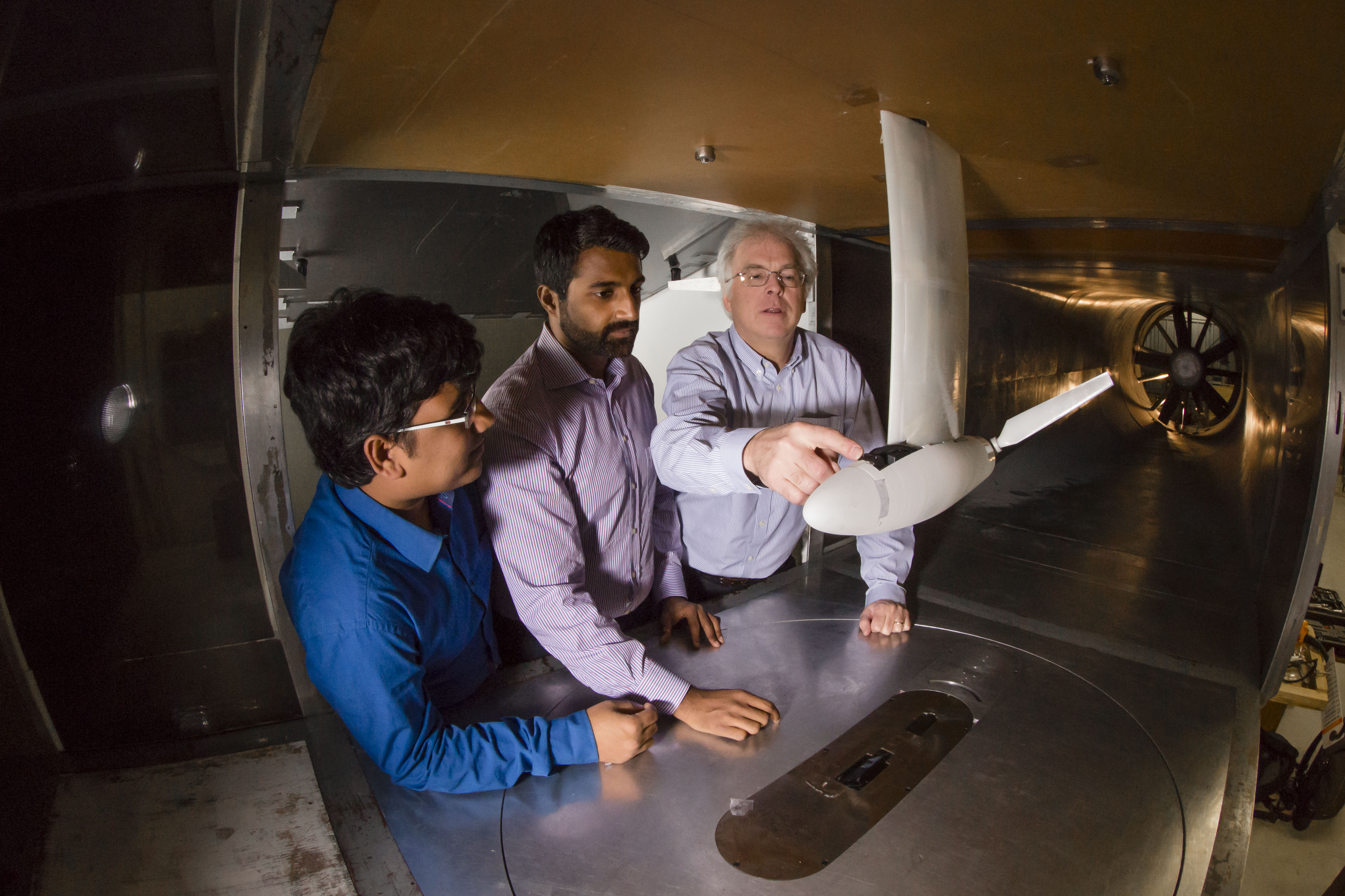 Selig instructing students on how to test an airfoil in a wind tunnel.